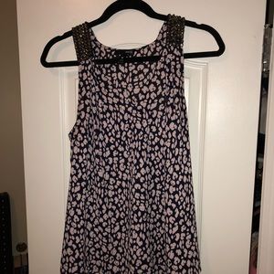 Floral tank top with beautiful beading on straps.